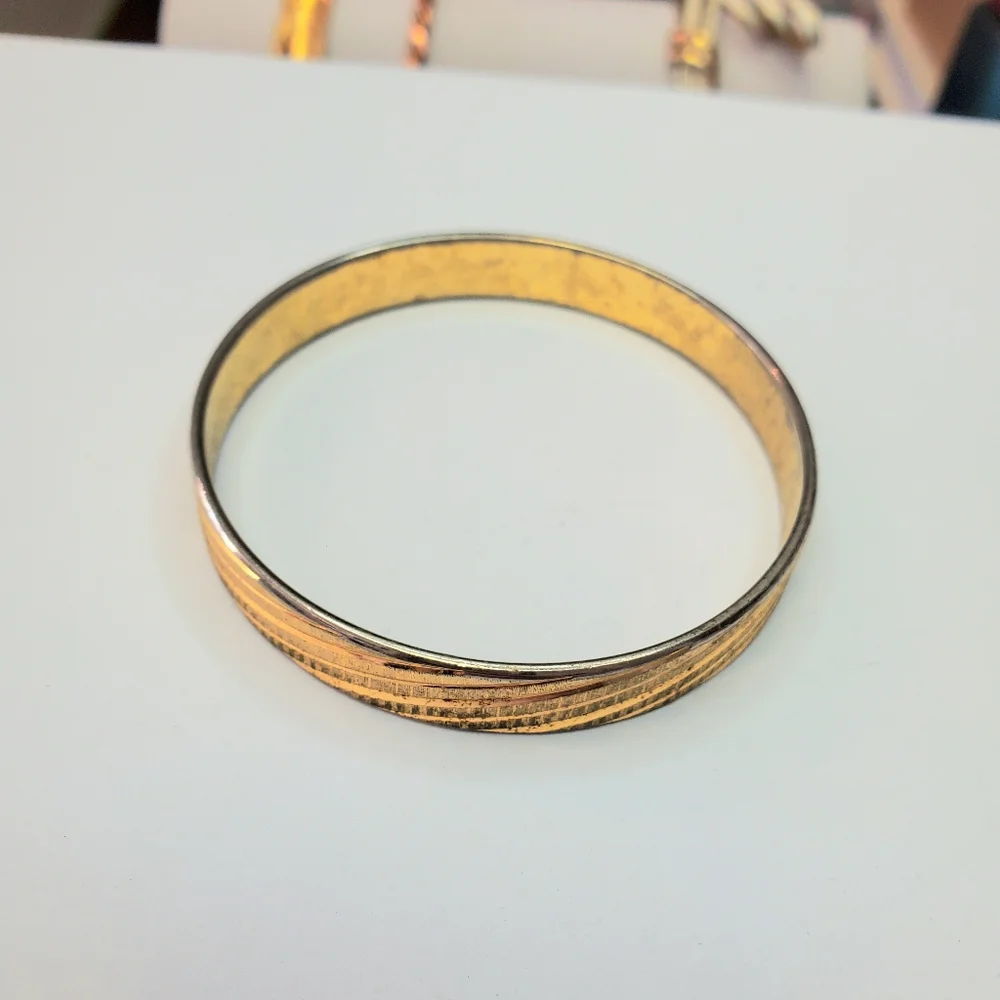 Solid metal gold colored costume bracelet